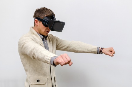 Man in virtual glasses imagining himself a bikerの写真素材