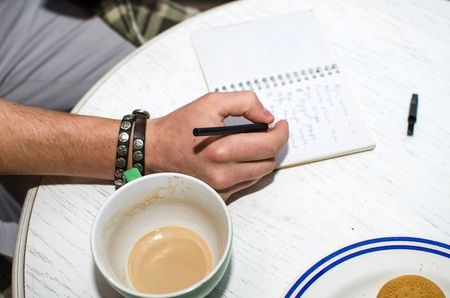 Young man using his notebook in handsの写真素材