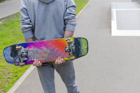 Young man with the skateboard in the parkの写真素材