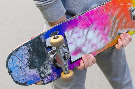 Young man with the skateboard in the parkの写真素材