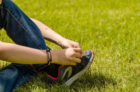 Young man enjoying time with teenager in the parkの写真素材