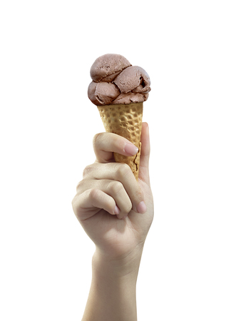A woman hand holding Chocolate ice cream scoop on coneの写真素材