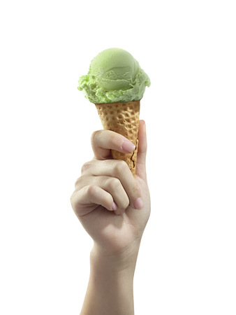 A woman hand holding Ice cream scoop on coneの写真素材