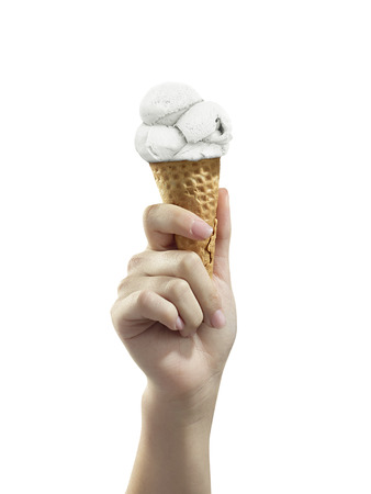 A woman hand holding Ice cream scoop on coneの写真素材