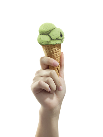 A woman hand holding Ice cream scoop on coneの写真素材