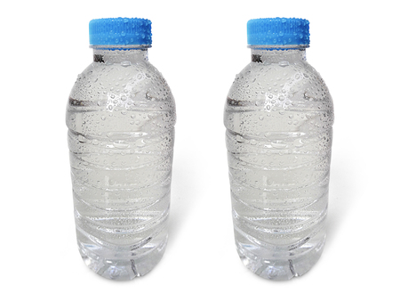 Small plastic water bottle with water drops. isolated on a white backgroundの写真素材