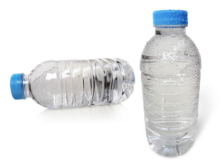 Small plastic water bottle with water drops. isolated on a white backgroundの写真素材
