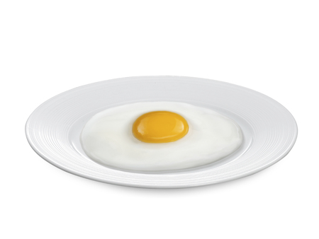 fried egg with on the plate a white backgroundの写真素材