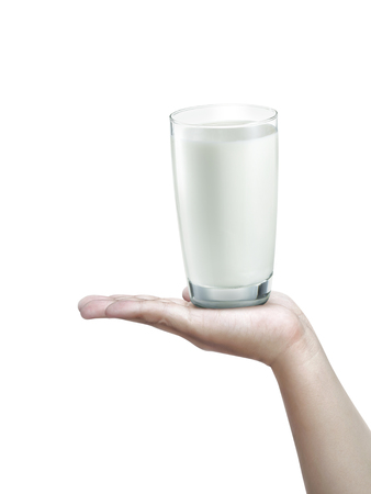 Glass of milk on human hands. isolated on a white backgroundの写真素材
