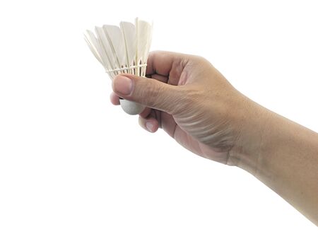 shuttlecock in hand isolated on white backgroundの写真素材
