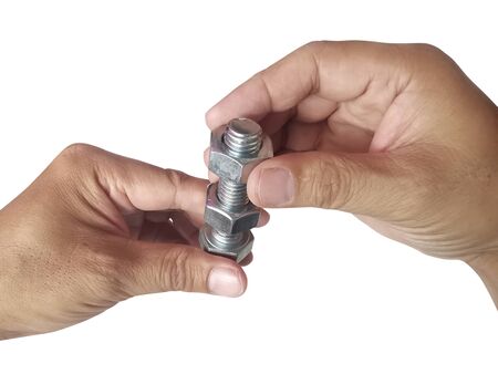 Nut and screw on hand on white backgroundの写真素材