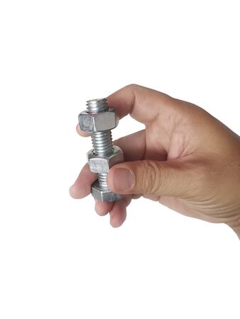 Nut and screw on hand on white backgroundの写真素材