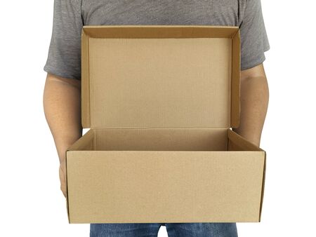 Delivery man holding cardboard boxes isolated on white