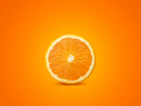 orange slices isolated on orange backgroundの写真素材