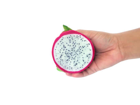 Male holding half of delicious ripe dragon fruit on white background