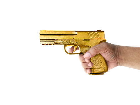 A man with gun gold metal isolated on white backgroundの写真素材