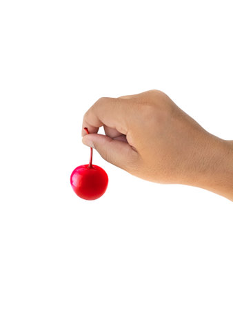 Hand holding the cherry on white background