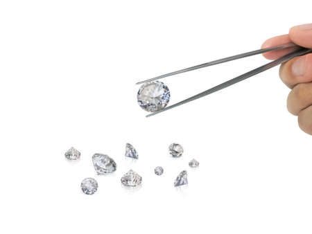 Select brilliant cut diamond held by tweezersの写真素材