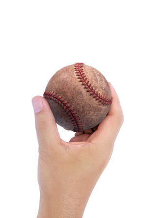 Baseball in hand on white backgroundの写真素材