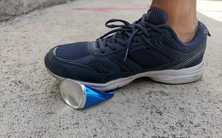 human foot stomp cans flat.の写真素材