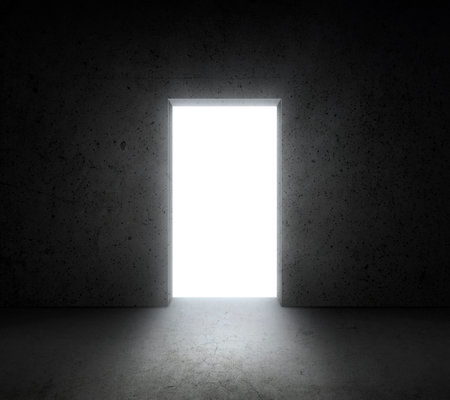 Bright white light shines from door in dark room. Dream, success, opportunity. concept businessの写真素材
