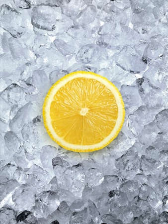 Fresh lemon on ice cubes backgroundの写真素材