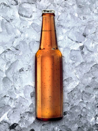 Beer bottle on ice cubes backgroundの写真素材