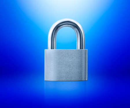 Locked Padlock on blue background idea conceptの写真素材