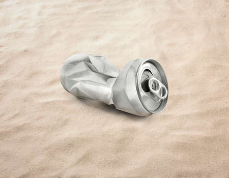 Empty soda or beer cans Crushed waste can be recycled on the sand, beach, seaの写真素材