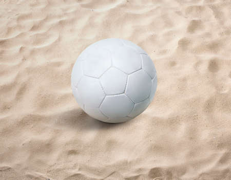Soccer ball on the sand, beach, seaの写真素材
