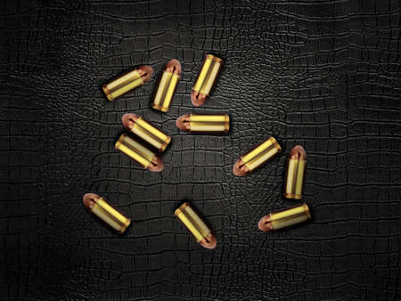 bullets on a black leather backgroundの写真素材