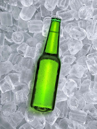 Beer bottle with water drops of cold beverage, ice cube a of juicy. Summer refreshing drinkの写真素材