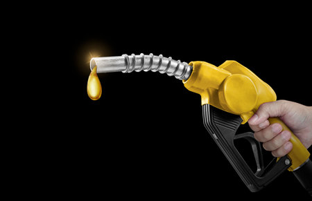holding fuel injectors on black backgroundの写真素材