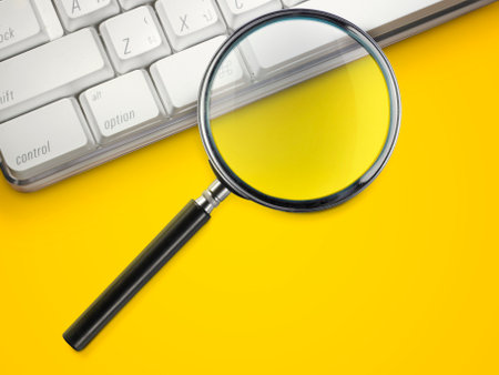 laptop computer with magnifying glass search conceptの写真素材