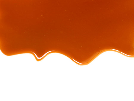 sauce caramel sweet isolated on white backgroundの写真素材