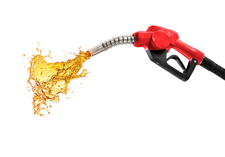 Petrol splashing out of pistol, isolated on white backgroundの写真素材