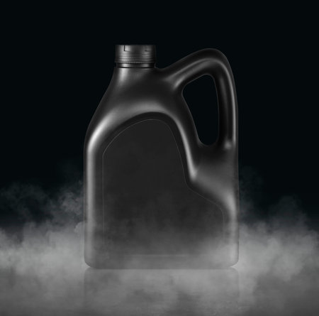 Plastic canister for machine oil with cold vapor an isolated dark studio backgroundの写真素材