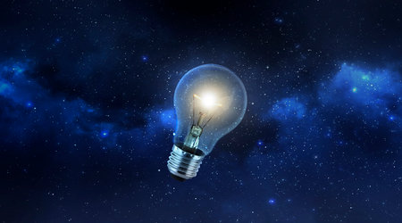 light bulb on a dark floor the Planet view from space. 3d renderの写真素材