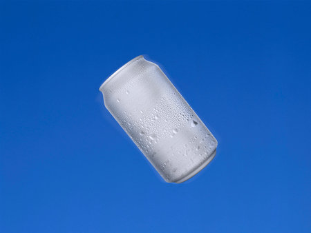 Aluminum cans shot in the air with blue sky background. 3d renderの写真素材