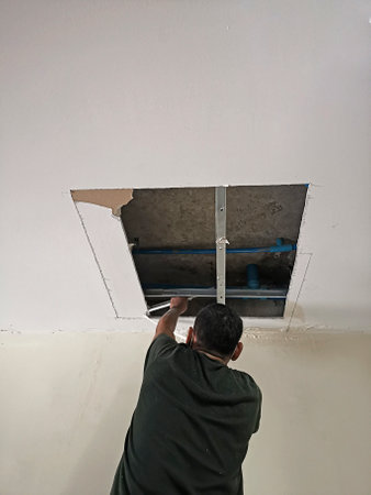 Workers dismantle the ceiling, open the ceilingの写真素材