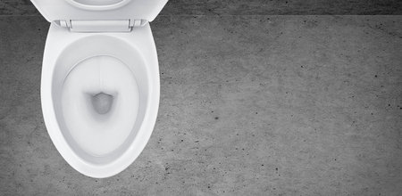 Top view of toilet bowl in the bathroom on cement backgroundの写真素材