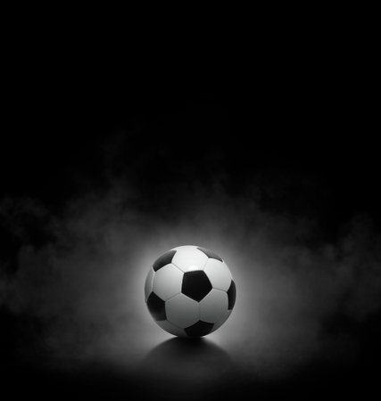 Soccer ball with on black background with smokeの写真素材