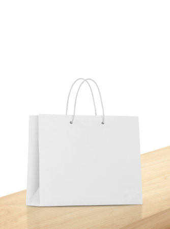 Empty shopping bags on wooden floor for advertisingの写真素材