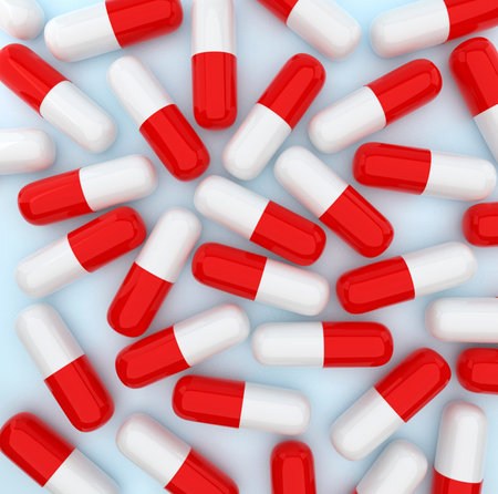 Top view. Medicine capsules on the light blue background