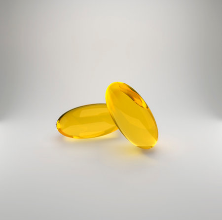 Golden oil capsule of vitamin A, E, Omega 3 or collagen. of medical pill with fish fat or organic cosmetic oilの写真素材