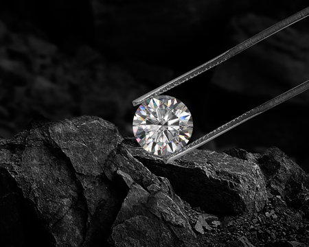 Cut Beautiful diamond held by tweezers on black coal background