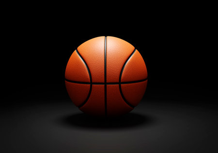 Orange basketball ball on black backgroundの写真素材