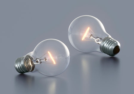 Light bulb with bright light on color backgroundの写真素材
