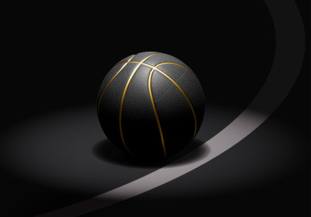 A black basketball with gold lines on a dark basketball courtの写真素材
