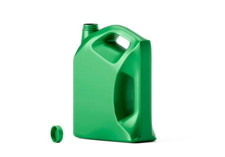 Opened empty green plastic engine oil bottle isolated on white backgroundの写真素材